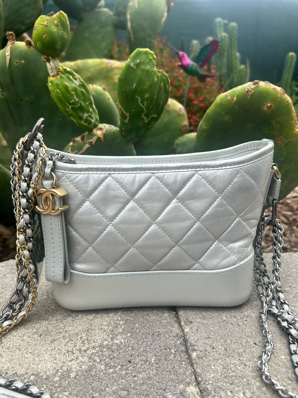 CHANEL Quilted Silver Leather Crossbody with Gold CC Charm